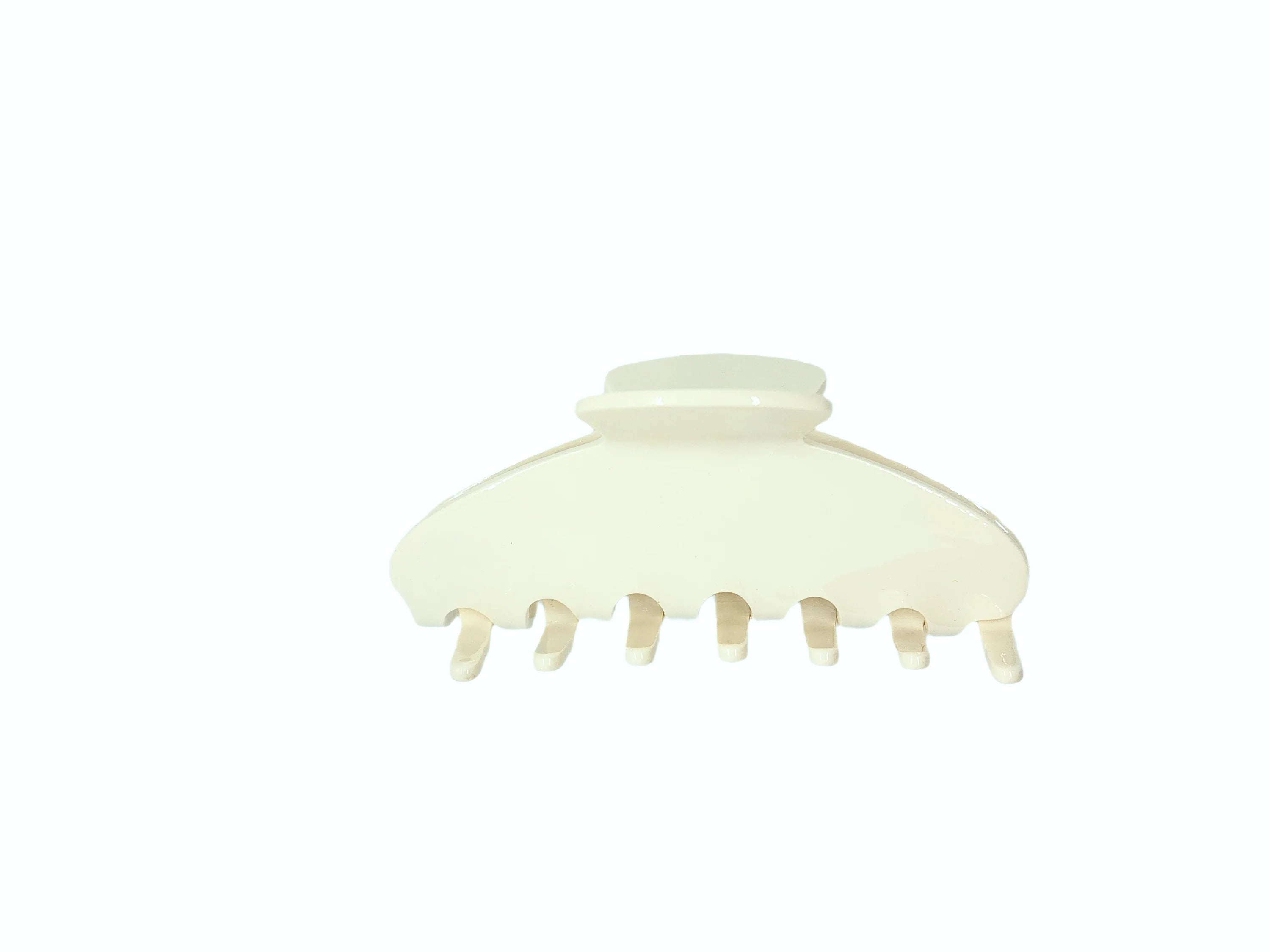 Large off-white acetate hair claw clip with smooth curved shape and strong grip.